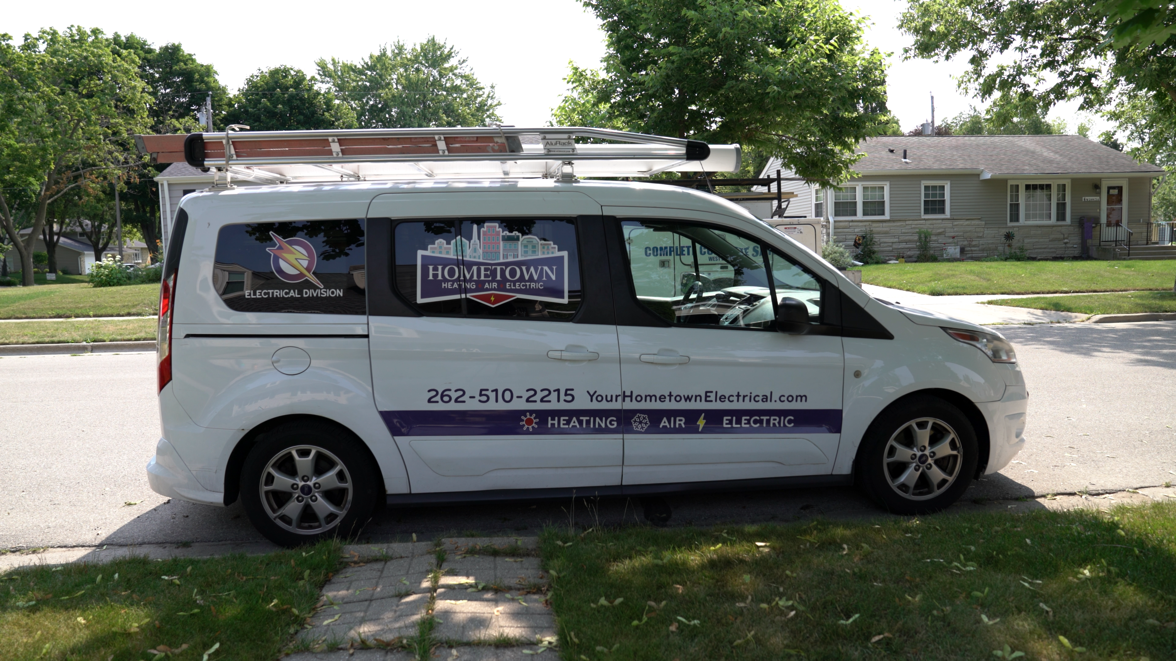 a Hometown Heating, Air & Electric HVAC van, representing how homeowners can protect their homes against carbon monoxide poisoning by regularly maintaining their HVAC system